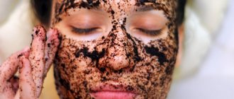 The girl has smeared herself with coffee grounds and lies with her eyes closed