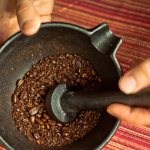 coffee is crushed with a pestle and mortar